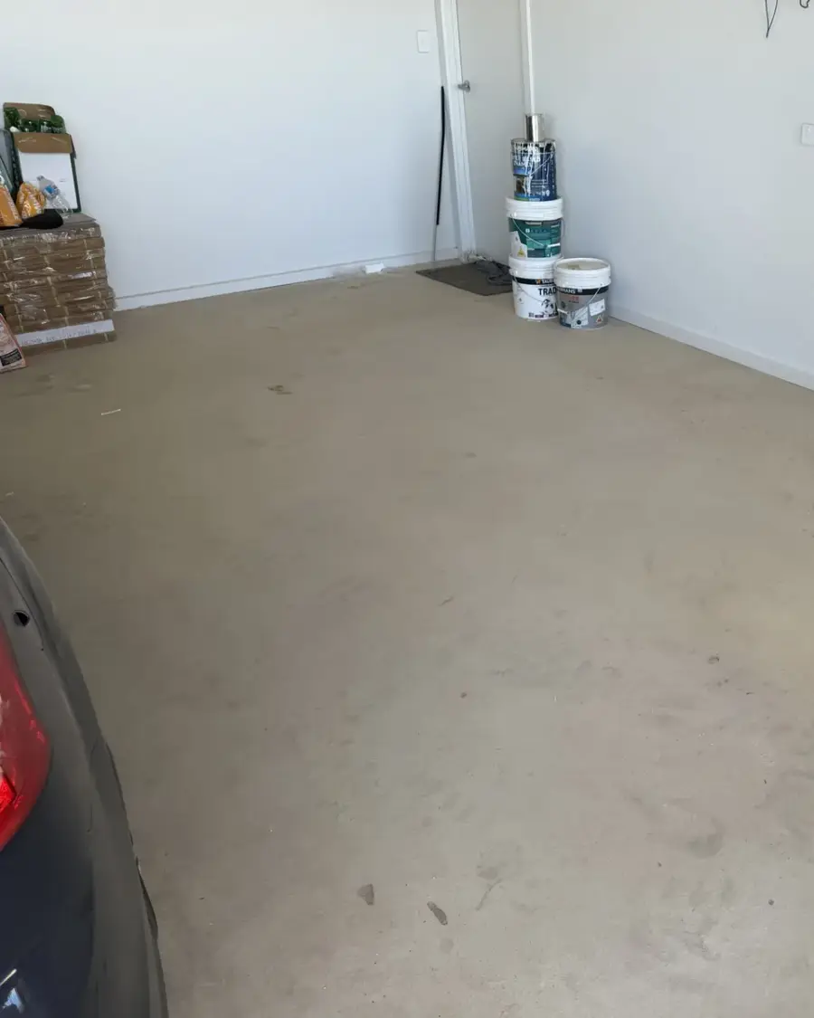 After: Renovation debris gone, leaving a bare swept floor