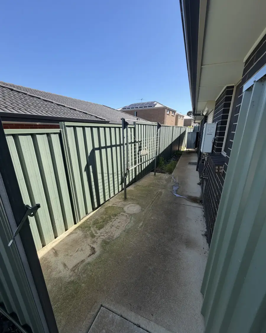 After: Clear side path along the fence