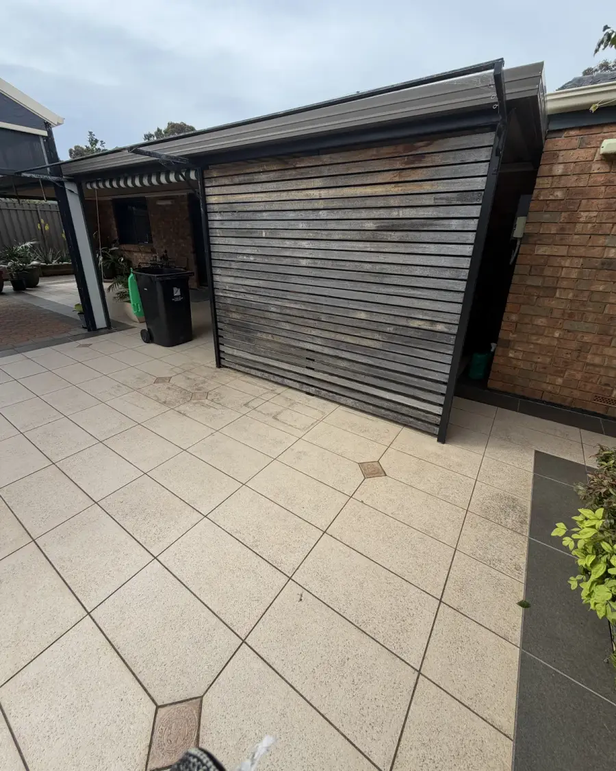 After: Paved courtyard cleared of the suitcases and junk